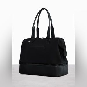 The Weekender in Black Travel Bag.  Used one time, superb condition.